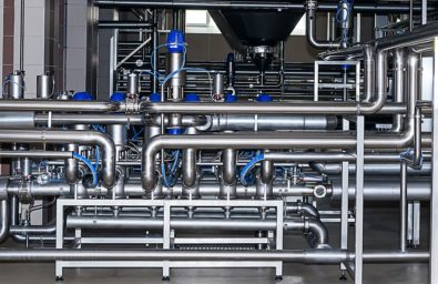 Stainless pipes,pumps and valves in modern brewery.